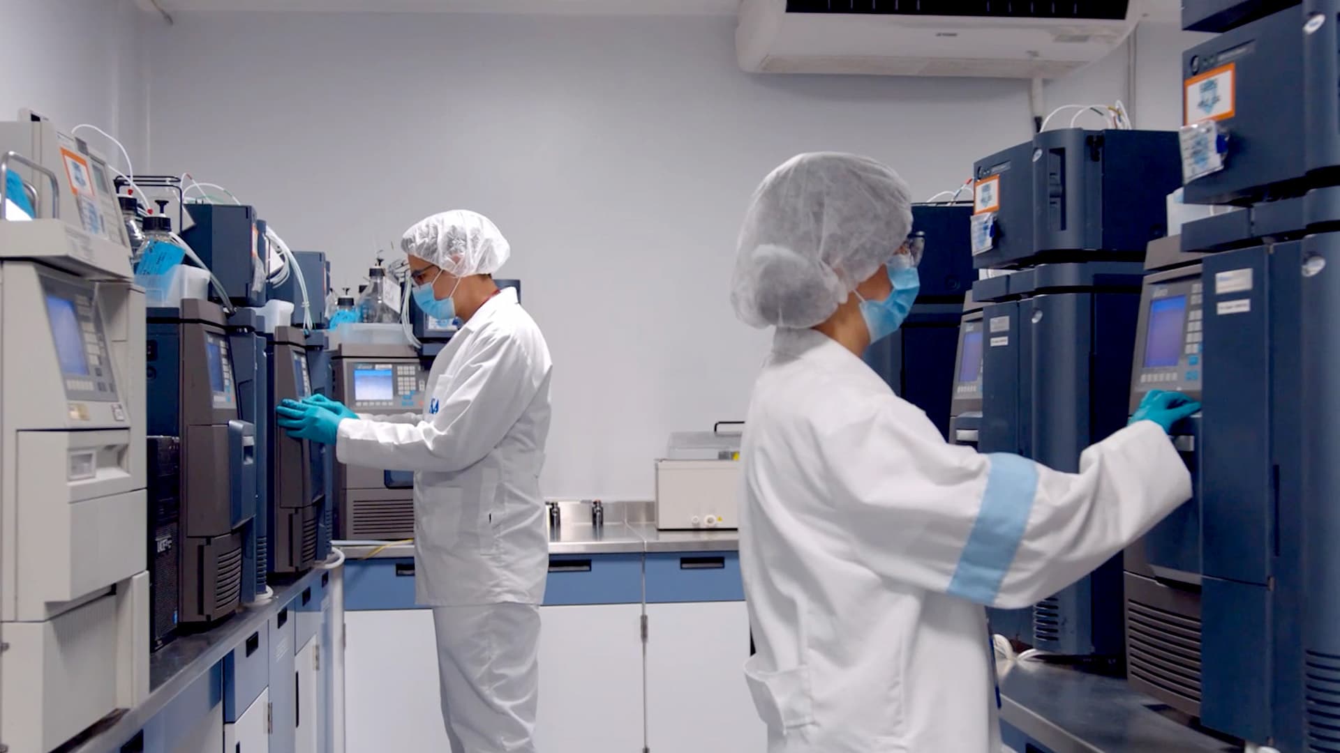Scientists working with analytical equipment